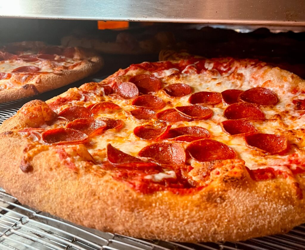 Tasty pizza being cooked for catering services